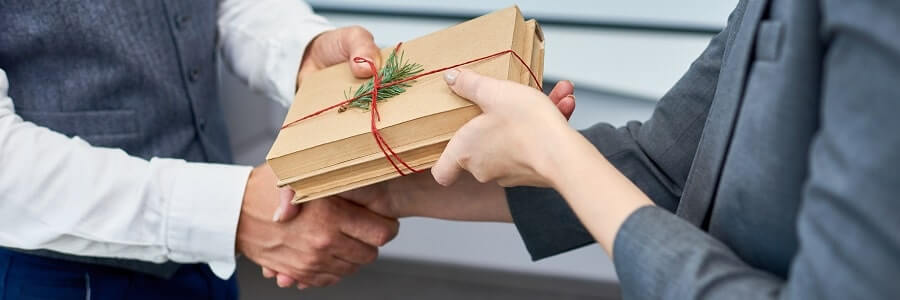 Business Professionals Exchanging Gift