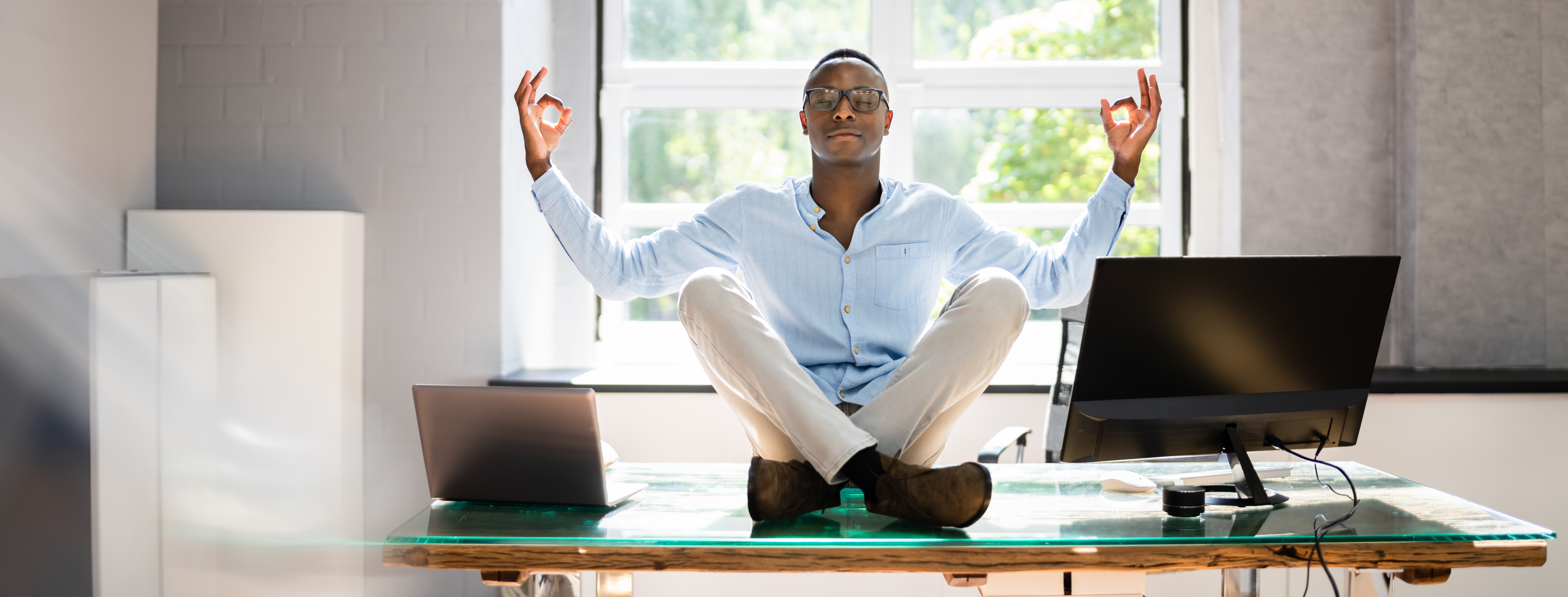 African Employee Doing Mental Health Yoga Meditation In Office